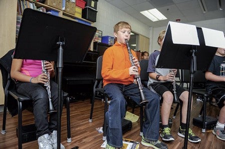 Carson Rasmussen plays the clarinet during rehearsal at band camp Thursday afternoon at I.J. Holton Intermediate School. 