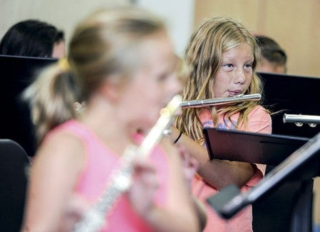 Lily Heichel rehearses with the rest of the flutes during band camp Thursday afternoon at I.J. Holton Intermediate School.  Photos by Eric Johnson/photodesk@austindailyherald.com