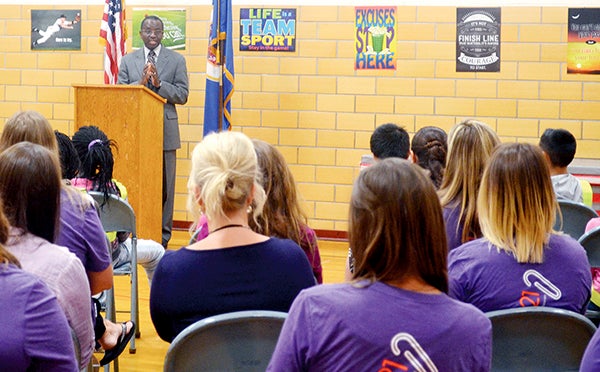 Riverland Community College President Adenuga Atewologun speaks at Sumner Elementary School about a partnership between Austin Public Schools, Winona State University and Riverland Tuesday morning. -- Jenae Hackensmith/jenae.hackensmith@austindailyherald.com