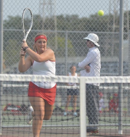 Austin's Taylor Taucnitz watches her shot during her No. 1 doubles match against Rochester Century in Paulson tennis courts Thursday. Rocky Hulne/sports@austindailyherald.com
