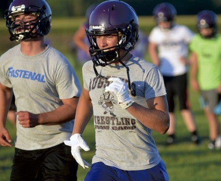 Grand Meadow's Brenn Olson, right, and Michael Oehlke, run during a drill in practice in Grand Meadow Monday. Rocky Hulne/sports@austindailyherald.com