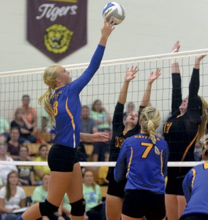 Hayfield's Katelyn Bjornson goes up for a tip kill against Medford in Hayfield Monday. Rocky Hulne/sports@austindailyherald.com