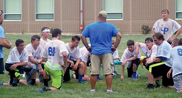 The Lyle-Pacelli football team meets after practice at Lyle High School Thursday. Rocky Hulne/sports@austindailyherald.com