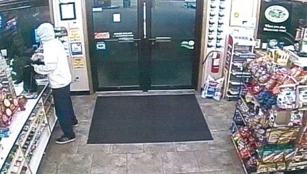 Surveillance video shows the armed suspect during Monday night’s robbery. Photo provided
