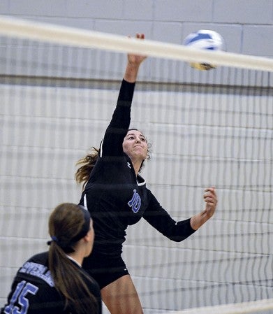 Riverland's Hope Landsman hits in game three of a match against Western Technical College Wednesday night at Riverland Community College. Eric Johnson/photodesk@austindailyherald.com