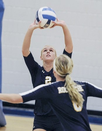 Hayfield graduate and RCTC’s Jessie Foster sets for Ashley Bichel during game one of their match against Riverland earlier this season. Herald File Photo 