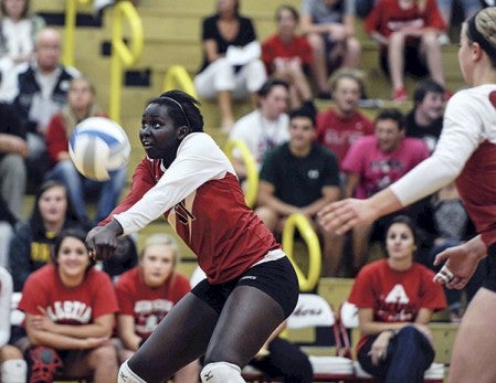 Austin’s Awenia Nywesh receives a serve against Mankato West in game one Tuesday night in Packer Gym. Eric Johnson/photodesk@austindailyherald.com