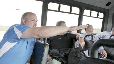 Austin Public Works Director Steven Lang points out work going on at Austin Municipal Airport Monday. 