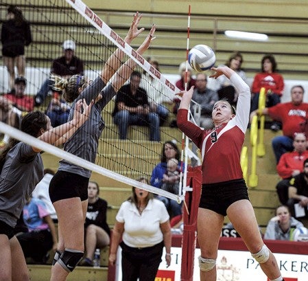 Austin’s Shayley Vesel quick-sets over the net in game one against Red Wing Tuesday night. Eric johnson/photodesk@austindailyherald.com