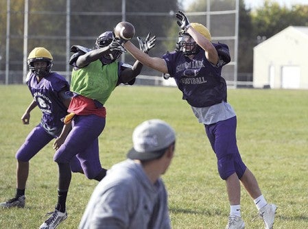 Grand Meadow’s Michael Stejskal breaks up a pass intended for Cody Ojulu during practice Wednesday afternoon. Eric Johnson/photodesk@austindailyherald.com