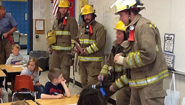The Lyle Fire Department visited the Lyle kindergarten class as part of Fire Prevention Week.   -- Photo provided by Melanie Jiskra