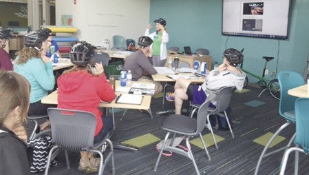 Participants listen during a class to help teach educators on the Bicycle Alliance of Minnesota (BikeMN) and their Walk! Bike! Fun! curriculum last month. Vision 2020 Bike Walk Trails committee collaborated with Mower County SHIP to bring the free BikeMN training to Austin.  Photo provided