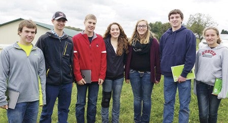 Several Austin High School students competed in Livestock Evaluation and Dairy CAttle Evaluation Oct. 9. Students from left: Noah Carroll, Evan Meiergerd, Michael Carroll, Hannah Burkhart, Kristine Schechinger, Josh Irvin, Maia Irvin. Photo provided.