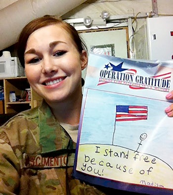 A soldier poses for a photo she received during a past Halloween Candy Buyback.  -- Photo provided by  Dentists Elrod, Green and Hyland DDS