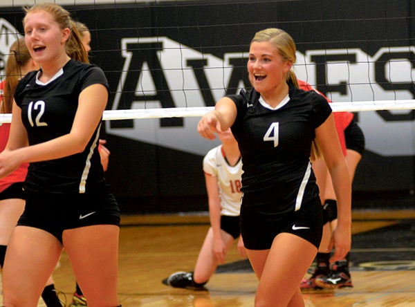 Blooming Prairie's Courtney Wobschall, left, Abby Wayne celebrate a point scored against LeRoy-Ostrander Monday. Rocky Hulne/sports@austindailyherald.com
