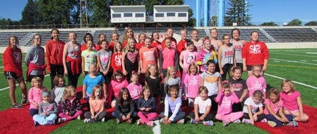  Participants pose after a youth cheerleading camp in September.