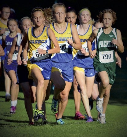 Pacelli's Kayla Christopherson, right, runs with a group of Waseca runners in Zumbrota Thursday. Rocky Hulne/sports@austindailyherald.com