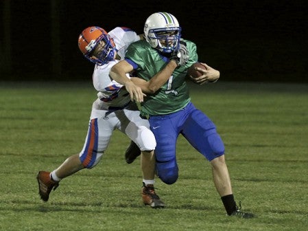 Lyle-Pacelli's Jordan Cotter is tackled against Randolph in Lyle. Photo Provided by Faye Bollingberg