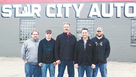 Star City Auto, formerly Carney Auto, has two new faces among the small staff. From left: Dan Garnatz, Matt Price, general manager Jim Royston, owner David Watson, and Matt Hennager. Not pictured is Lowell Evans.  Photos by Jenae Hackensmith/jenae.hackensmith@austindailyherald.com