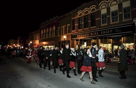 The Austinaires lead the parade down Main Street to kick off Christmas in the City Friday night. Eric Johnson/photodesk@austindailyherald.com