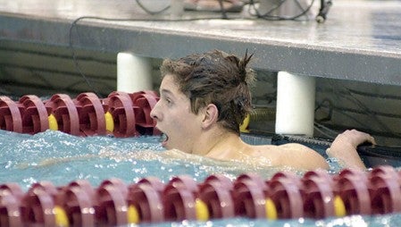 Austin’s Craig Heimark reacts to winning the 100-yard freestyle at the Class A state swimming and diving meet in the University of Minnesota Aquatic Center last March. Herald file photo