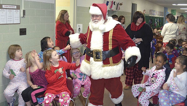 Santa Clause visits kindergarteners when the Polar Express made it to the North Pole in Woodson Kindergarten Center Wednesday morning. 