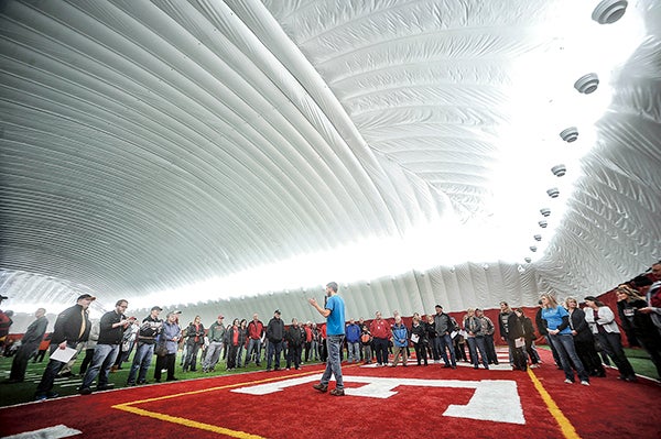 Greg Siems, director of Vision 2020, welcomes everybody to the dome over Art Hass Stadium during the open house Saturday morning.  Eric Johnson/photodesk@austindailyherald.com