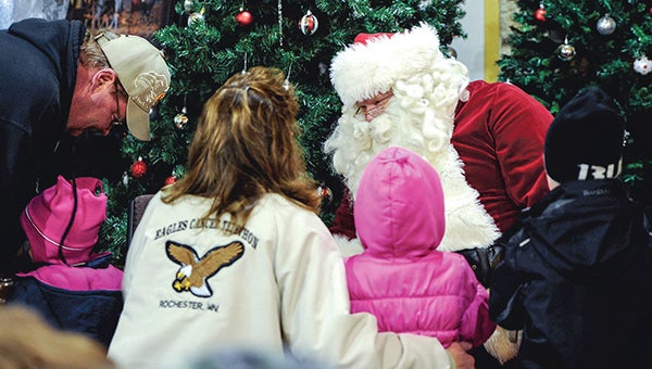 Santa Claus was a busy man Saturday night at the annual Mower County Historical Society’s Christmas in the County at the Mower County Fairgrounds. -- Eric Johnson/photodesk@austindailyherald.com