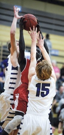 Austin’s Mark Manyuon goes up in pressure against Red Wing Tuesday night in Packer Gym. Eric Johnson/photodesk@austindailyherald.com