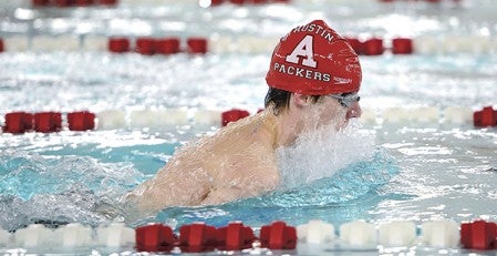 Zach Newman swims the breaststroke in the 200 medley relay Tuesday night against Rochester Century at Bud Higgins Pool. Eric Johnson/photodesk@austindailyherald.com