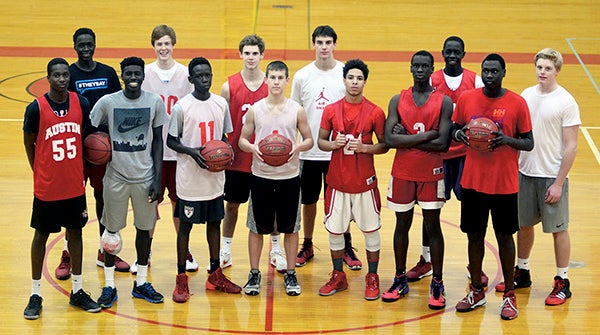 The Packers boys basketball team has had plenty of contributors this season. Back row (left to right): Both Gach, Jace Murray, Zach Coffey, Trent Brown, Duoth Gach and Kyle Oberbroeckling; front row: Jany Gash, Mark Manyuon, Deng Deng, Tate Hebrink, Elijah Andersen, Moses Issa and Oman Oman. Rocky Hulne/sports@austindailyherald.com