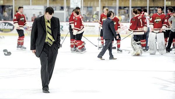 Austin Bruins head coach  Chris Tok walks off the ice as  the Minnesota Wilderness  celebrate winning the Robertson Cup in May. Herald file photo