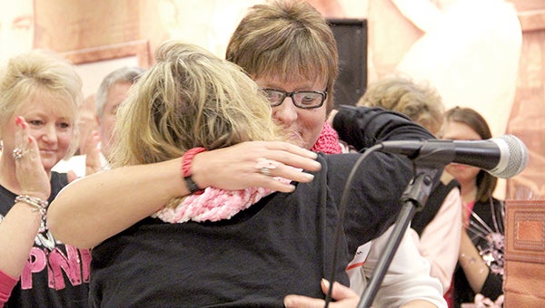 Paint the Town Pink ambassadors Kelly Joseph and Darci Buchan, right, hug during the PTTP kickoff at The Hormel Institute on Tuesday.-- Photos by Jason Schoonover/jason.schoonover@austindailyherald.com