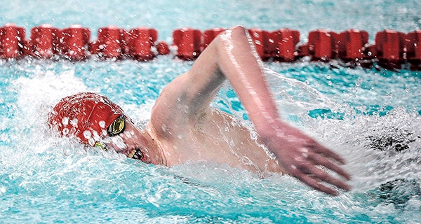 Austin’s Ethan Thompson swims in the 200 yard freestyle in a dual against Northfield Tuesday night. Eric Johnson/photodesk@austindailyherald.com