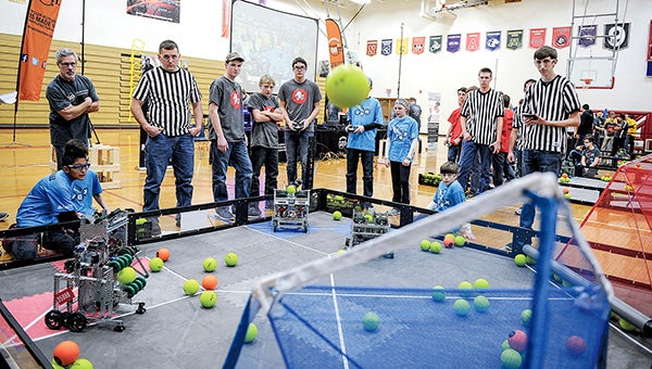 Members of the Mysterious George and I.J. Holton robotics teams compete Saturday at the Robotics VEX competition in Packer Gym. -- Photos by Eric Johnson/photodesk@austindailyherald.com