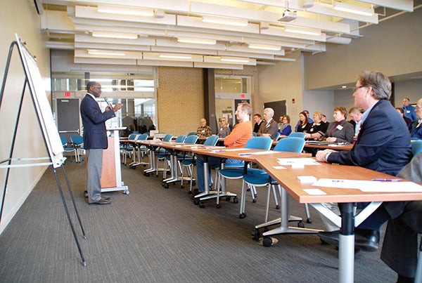 Riverland Community College president Dr. Adenuga Atewologun speaks during a summit to discuss meeting Minnesota’s workforce needs Friday in Owatonna.  Photo by the Owatonna’s People’s Press
