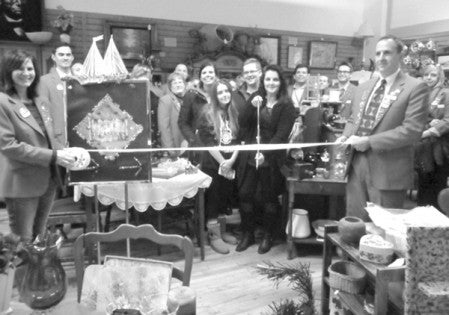 NEW LOCATION. Chamber Ambassadors welcomed A2Z Treasures & Thrift Store to their new location, 311 4th Street SE, with a ribbon cutting, Dec. 4. Owned and operated by Jane Kulberg, center, the store offers a wide variety of household and collectible items, furniture and more. Photo provided