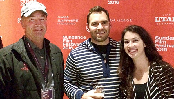     Four Daughters Vineyard & Winery co-owner Gary Vogt, winemaker Justin Osborne and marketing director Kristin Osborne pose for a photo in Park City, Utah, last weekend during the Sundance Film Festival. Four Daughters was selected as the festival’s official wine provider.
