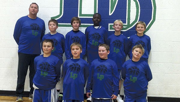 The Lye-Pacelli boys fifth-grade basketball team took first place in the Lyle Legacy Tournament. Back row, from left: Coach-Carl Truckenmiller, Mac Nelson, Mitchel Johnson, Otang Nyikwew, Hunter Bauer and Jakob Truckenmiller. Front row: Trey Anderson, Jaden May, Cayden Hansen and David Christianson.  Photo Provided