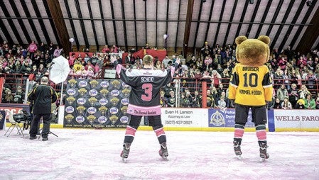 Ian Scheid steps up to have his jersey auctioned during last year’s jersey auction in Riverside Arena. Herald file photo