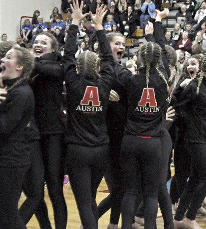 The Austin Packer Dance Team celebrates its second place finish in high kick, clinching its 14th straight trip to state at the Section 1AA Meet in Albert Lea Saturday. 