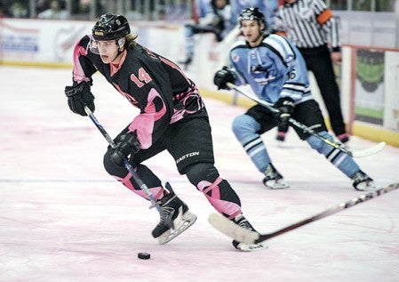 The Bruins Jan Stefka moves the puck into the Coulee zone during the second period Saturday night at Riverside Arena. It was the annual Paint the Rink Pink game. Photos by Eric Johnson/photodesk@austindailyherald.com