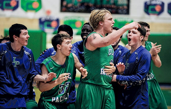 Lyle-Pacelli celebrates after beating Randolph in double-overtime in the Section 1A West Tournament Thursday night in Pacelli. Eric Johnson/photodesk@austindailyherald.com