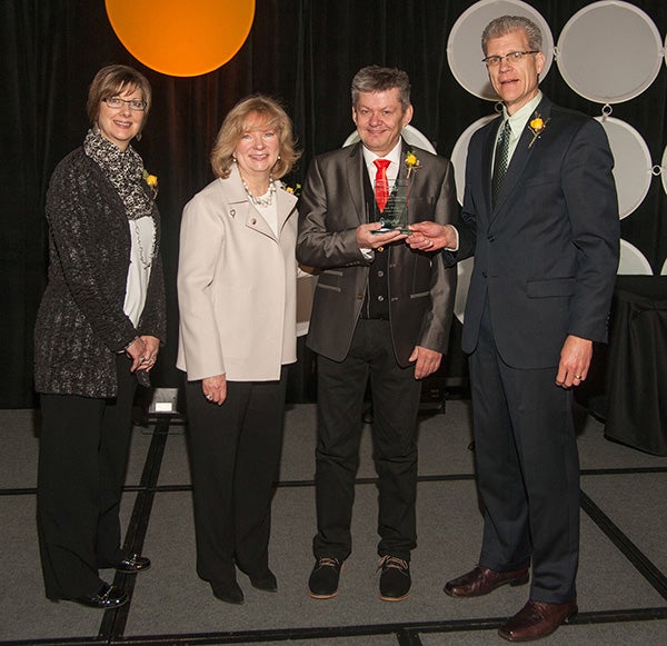 Jack Erwin, director of dining services at The Cedars of Austin, second from right, accepts the Ray Johnson Leadership in Action Award from Jon Lundberg, the chairman of the LeadingAge Minnesota board of directors. Also picture, from left, are Libby Lindberg, LeadingAge Minnesota awards committee vice chair and Gayle Kvenvold, president and CEO of LeadingAge Minnesota. Photo provided 