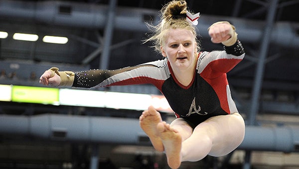 Austin’s Maddie Mullenbach competes on the floor Saturday during the Minnesota Class A Individual State Gymastics Meet at the University of Minnesota Sports Pavillion. Eric Johnson/photodesk@austindailyherald.com