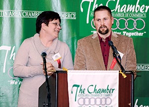 Todd and Gina Grundmeier accept their award after being named Business of the Year during the annual Chamber Banquet last year at the Holiday Inn Convention Center. -- Herald file photo