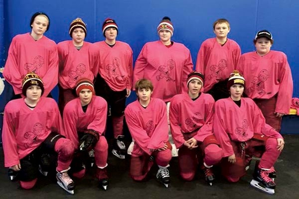 The Austin PeeWee A hockey team played its Pink Game this past Saturday. Austin defeating Farmington and raising $1,990 from their jersey auction for the Hormel Institute. Photo Provided