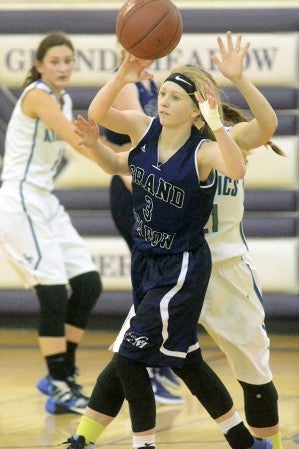 Grand Meadow’s Skylar Cotten passes the ball agaisnt Lyle-Pacelli in GM Monday. Rocky Hulne/sports@austindailyherald.com