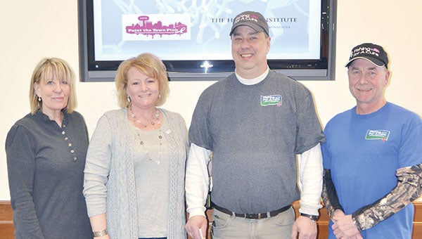 Fishing for a Cure organizers Glenn Newman and Jim Nelson presented a check recently to Paint the Town Pink Director Kathi Finley and Gail Dennison, director of Development & Public Relations at The Hormel Institute. Fishing for a Cure raised a record-breaking $14,000 for Paint the Town Pink and The Institute. Since 2009, the ice-fishing event has raised over $66,000 for Paint the Town Pink.