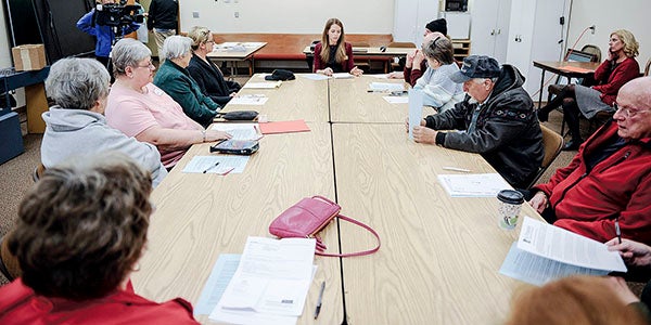 Seniors sat down with Samantha Mills, center, and other members of Sen. Al Franken’s office Friday morning at the Mower County Senior Center to discuss prescription drug costs. Eric Johnson/photodesk@austindailyherald.com 